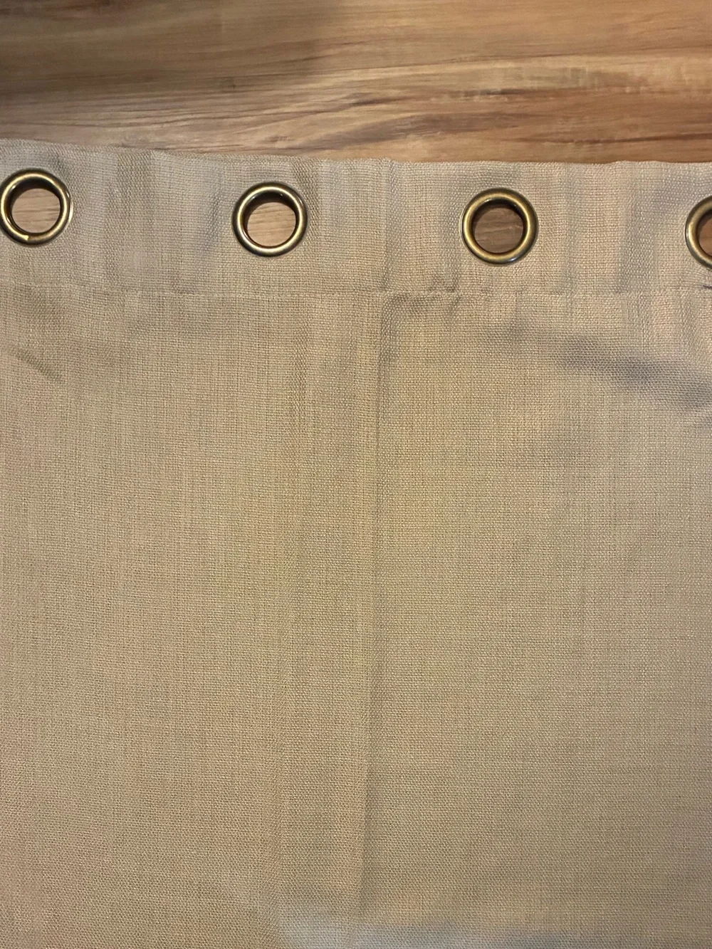 Tan grommet-top curtain panel measures approximately 90 in length 50 width. EUC